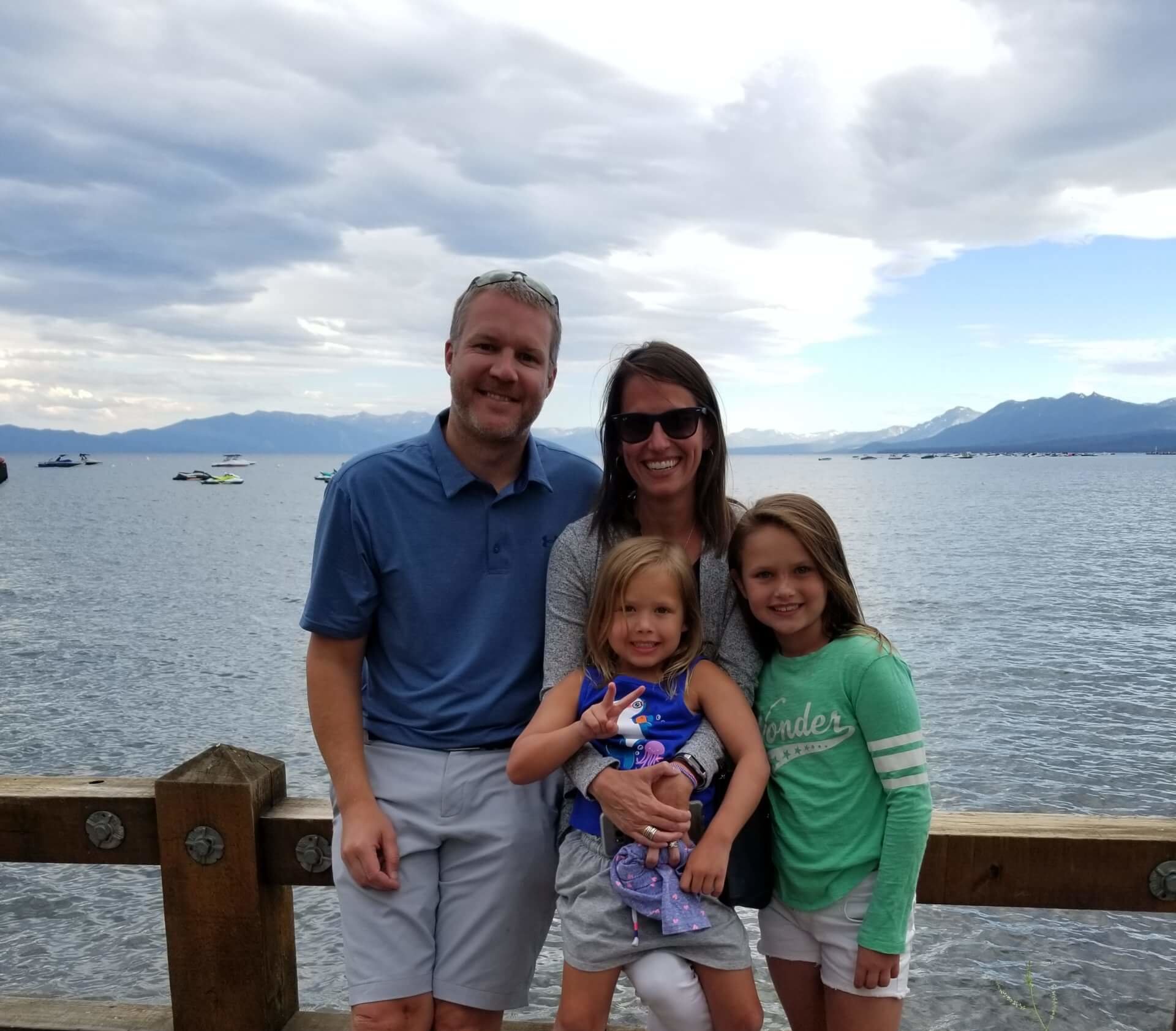 derek prosser with wife and two girls by a lake in texas